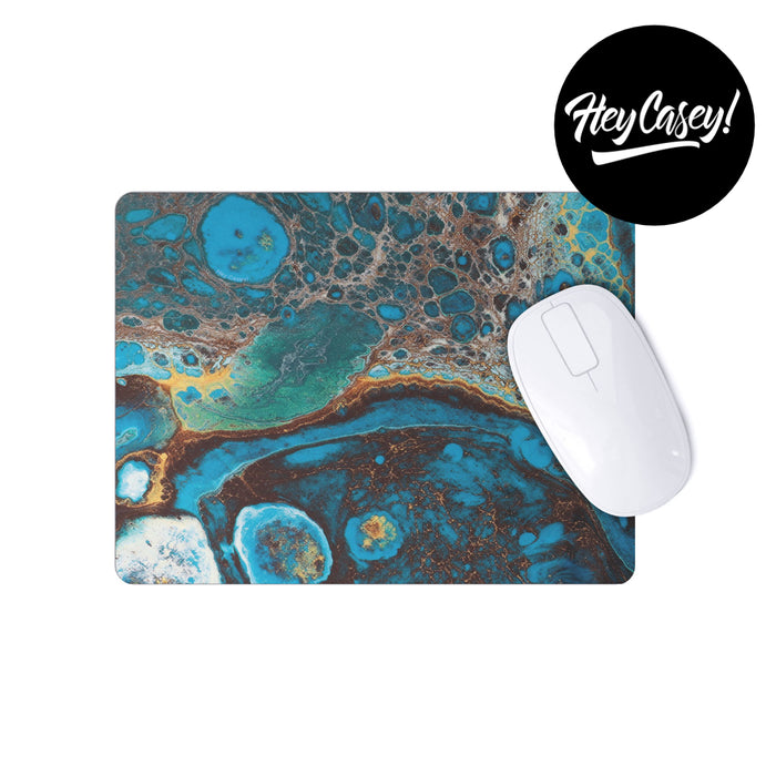 Aquamarine and gold ink patterned mouse pad