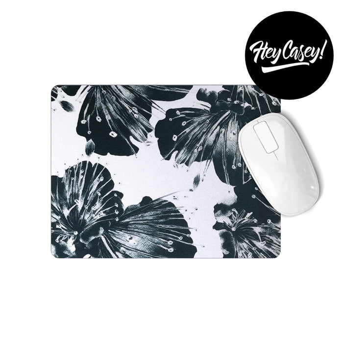 Modern black and white floral painted design on a rectangular mousepad