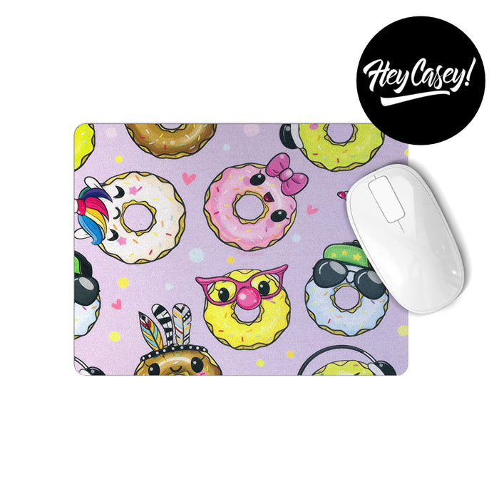 A mouse pad with a cute donut character print